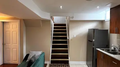 a staircase leading up to a kitchen with a stair case at 2 Bed-2Bath-Kitchen Private Family Couple Work in Newmarket
