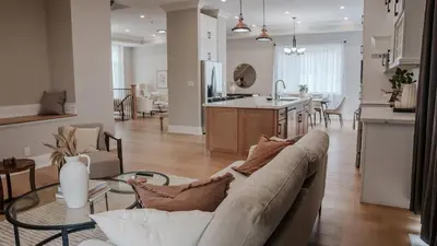 a living room and kitchen with a couch and a table at Upscale Pickering Escape Near Lake & Dining in Pickering