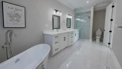 a white bathroom with two sinks and a toilet at Upscale Pickering Escape Near Lake & Dining in Pickering