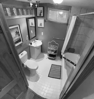 a bathroom with a toilet and a sink and a shower at Country Roads Dwelling in Dundas
