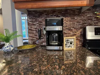 a coffeemaker sitting on a counter with a coffee maker at Vibrant and Comfy Mississauga Home 20 mins from YYZ in Mississauga