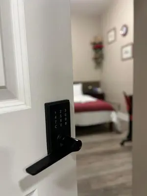 a door with a remote control in a room at Downtown Private Room Central Location in Toronto