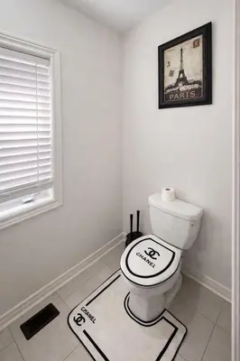 a bathroom with a toilet with a sign on the floor at 2024 Built Stylish 3BR Cambridge Townhouse with Free Parking, WiFi, Full Kitchen, Laundry, 8 Min Drive to African Lion Safari! Perfect for Family Travel, Group Trips & Work Stays! in Cambridge