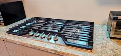 a stove top oven sitting on top of a counter at Luxury 5 Bed Retreat for 12 with Gourmet Kitchen in Paris