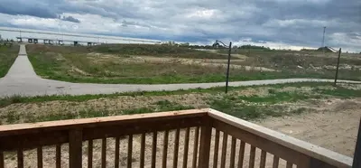 a view of a road from a balcony with a fence at Luxury 5 Bed Retreat for 12 with Gourmet Kitchen in Paris
