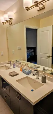 a bathroom with a sink and a large mirror at Luxury 5 Bed Retreat for 12 with Gourmet Kitchen in Paris