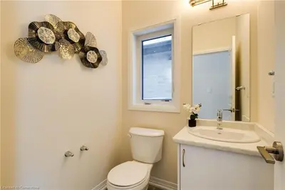 a bathroom with a toilet and a sink and a mirror at Luxury 5 Bed Retreat for 12 with Gourmet Kitchen in Paris
