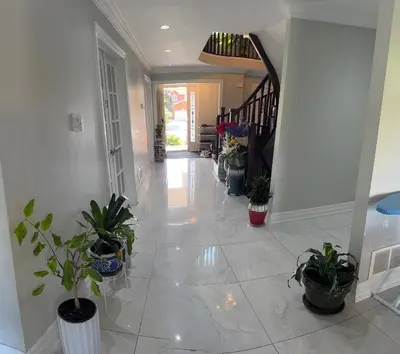 a hallway with potted plants in a house at Master bedroom suite on the 2nd floor, city center in Mississauga