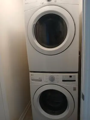 a washing machine and a dryer in a room at Home away from home in Cambridge