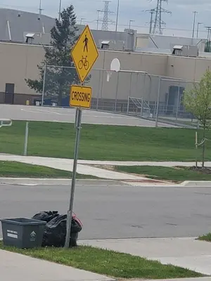 a pedestrian crossing sign on the side of a street at Home away from home in Cambridge