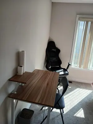a desk and a chair in a room with a window at Home away from home in Cambridge