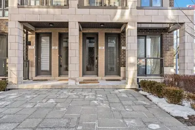 a building with a stone walkway in front of it at Stunning 2BR Toronto Retreat, Patio & Parking in Toronto