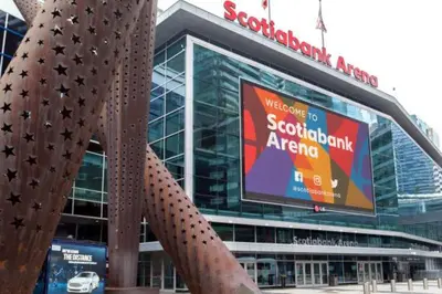 a large stadium with a large sign in front of it at Downtown Queen and King St - Lower Suite in Toronto