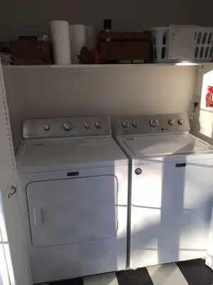 a kitchen with a stove and a stove top oven at The County Queen - Historic Home in Picton in Picton