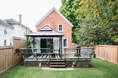 a gazebo in the yard of a house at The County Queen - Historic Home in Picton in Picton