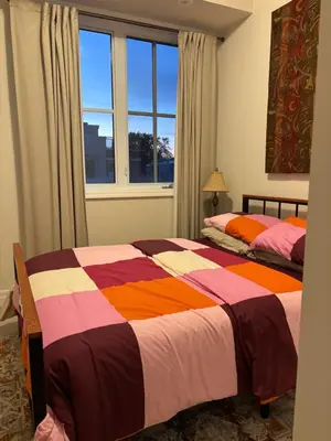 a bedroom with two beds and a window at Beautiful Quaint Home in Port Credit, Mississauga in Mississauga