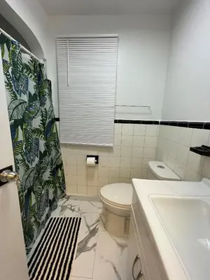 a bathroom with a toilet and a sink at The Basics - Private Room in Toronto