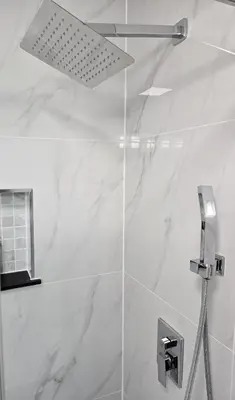a shower with a glass door in a bathroom at Streetsville Retreat - Prime Location in Mississauga