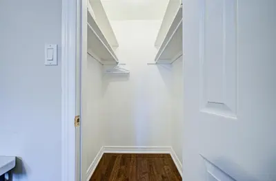 a hallway with a white door and a wooden floor at Upper-Level Classic House in Richmond Hill in Richmond Hill