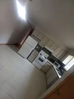 an overhead view of an empty kitchen with a light at Stay in Waterloo-Kitchener-Downtown-FREE WIFI & PARKING in Waterloo