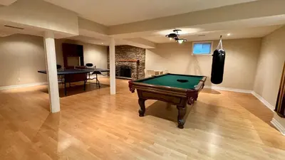 a living room with a pool table in it at Massive Luxury Retreat with Gym, Sauna, Games and More in Mississauga