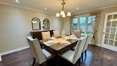 a dining room with a table and chairs at Massive Luxury Retreat with Gym, Sauna, Games and More in Mississauga