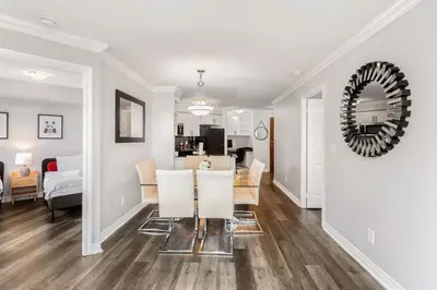 a dining room and living room with a table and chairs at Sky Retreat | 2BR-2BA High Floor | 180° City View in Mississauga