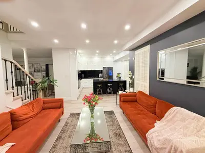 a living room with a couch and a table at Welcome to Your Home Away From Home! in Mississauga
