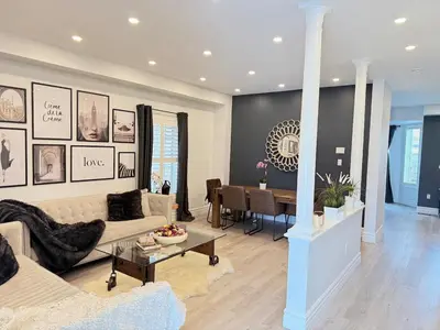 a living room with a couch and a table at Welcome to Your Home Away From Home! in Mississauga