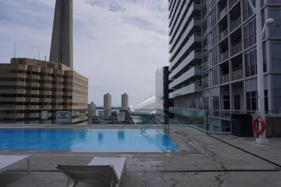 a swimming pool on the side of a building at Downtown Toronto Condo with CN Tower View in Toronto