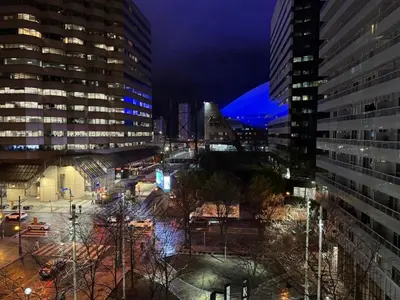 a view of a city at night with buildings at Downtown Toronto Condo with CN Tower View in Toronto