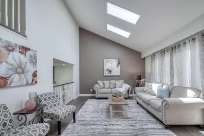 a living room with a couch and chairs at The Rosewood 1 Bedroom Basement Retreat in Vaughan