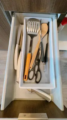 a drawer full of kitchen utensils in a cabinet at Luxury 1 BR and Den Near CN Tower in Toronto
