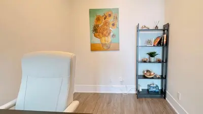a room with a white refrigerator and a shelf at Luxury 1 BR and Den Near CN Tower in Toronto