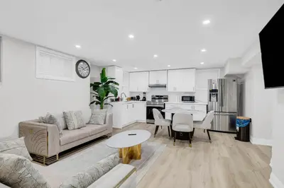 a living room with a couch and a table at Your Luxurious Caledon Escape in Brampton