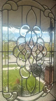 a stained glass window with a view of a yard at Private Room In Luxury Home in Innisfil