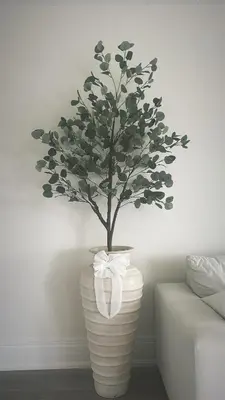 a vase with a tree in it with a bow at Private Room In Luxury Home in Innisfil