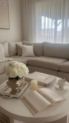 a living room with a couch and a table with flowers at Private Room In Luxury Home in Innisfil