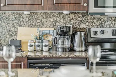 a kitchen counter with a coffee maker on it at Spacious 2BR Condo Downtown, Lakeshore, Parking in Toronto