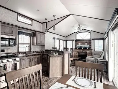 a kitchen with a table and chairs in a room at Bobcaygeon Shores Cottage Resort in Kawartha Lakes