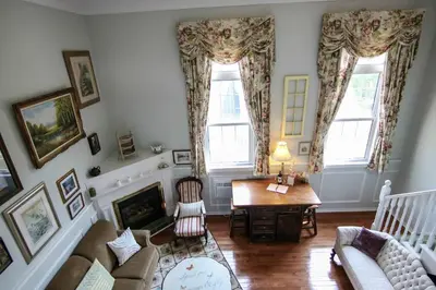 a living room with a couch and a table at The Jypsy Inn - The Royal Suite Bracebridge in Bracebridge