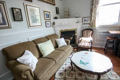 a living room with a couch and a table at The Jypsy Inn - The Royal Suite Bracebridge in Bracebridge