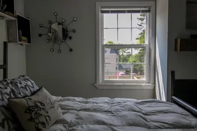 a bedroom with a bed in front of a window at The Jypsy Inn - Tuxedo Room Muskoka in Bracebridge