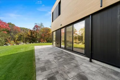 an external view of a house with a patio at Luxury Muskoka Retreat in Gravenhurst