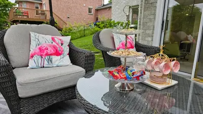 a table with a tray of food on a patio at Cozy 1BR Garden Suite Innisfil Beach Park in Innisfil