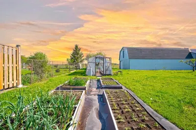a garden with a greenhouse in the middle of a field at Wonderful house in Niagara on the Lake