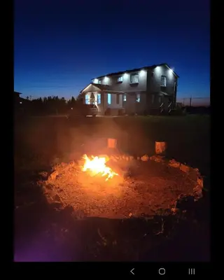 a fire in front of a house at night at Wonderful house in Niagara on the Lake