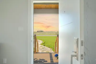 a door with a painting of a view of a field at Wonderful house in Niagara on the Lake