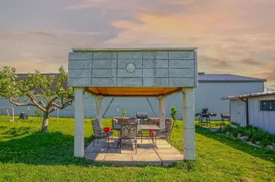 a gazebo with a table and chairs in a yard at Wonderful house in Niagara on the Lake
