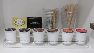 a shelf with a bunch of cups of coffee at Beautiful Separate Unit, GrandRiver & Kiwanis Park in Kitchener